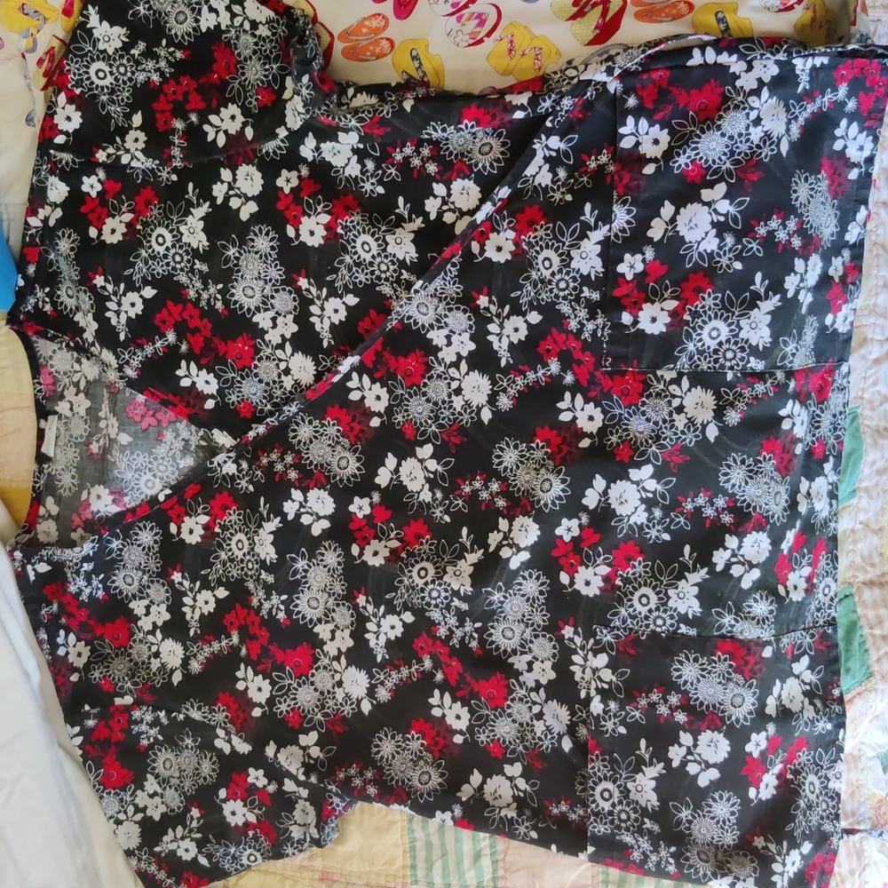 Four small sized women scrub tops never worn once. Two solid others decorative:)